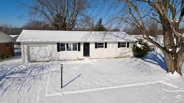 ranch-style house featuring a garage