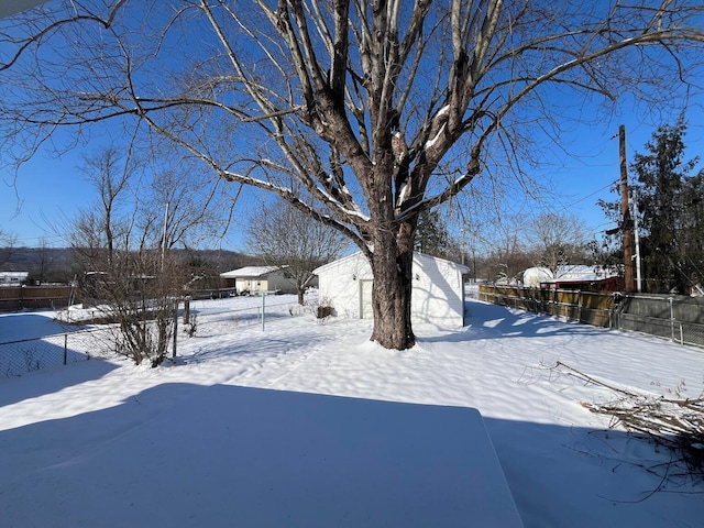 view of yard covered in snow