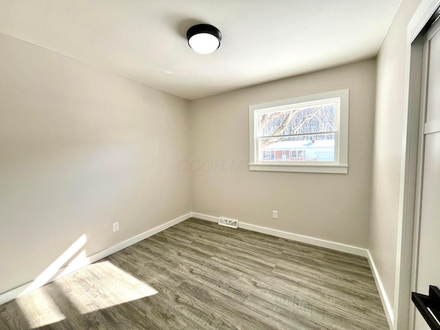 empty room featuring hardwood / wood-style flooring