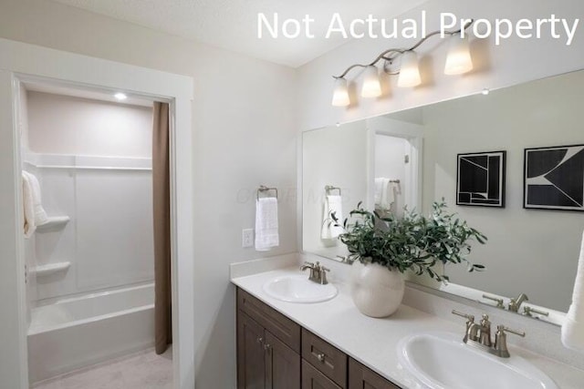 bathroom with tile patterned floors, vanity, and shower / bath combination