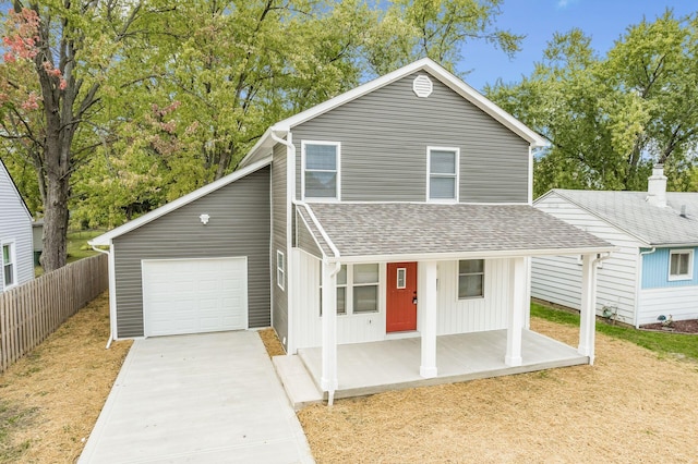 front of property with a porch and a garage