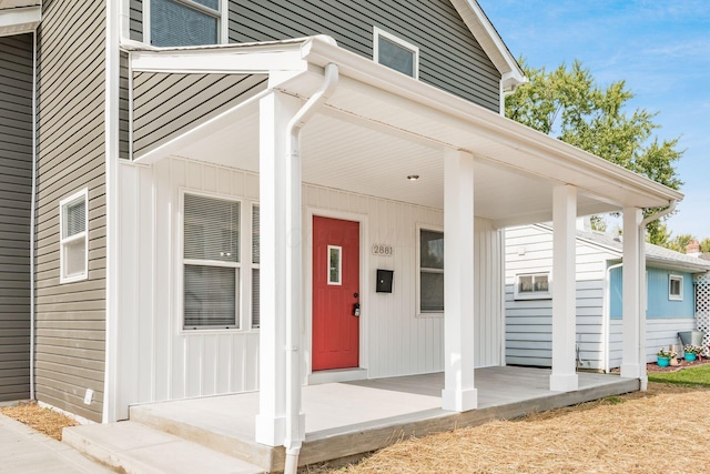 doorway to property with covered porch