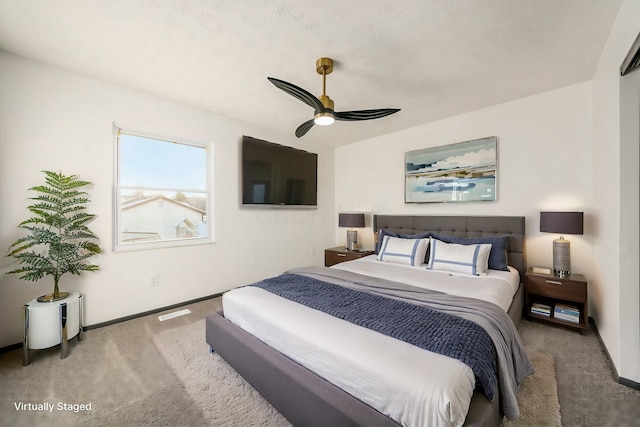 bedroom featuring ceiling fan and carpet floors