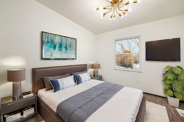 bedroom with a chandelier, vaulted ceiling, and dark colored carpet