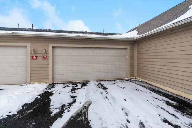 view of snow covered garage