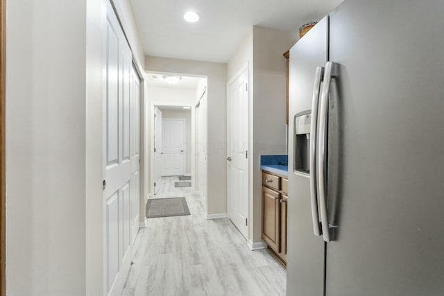 corridor featuring light hardwood / wood-style floors