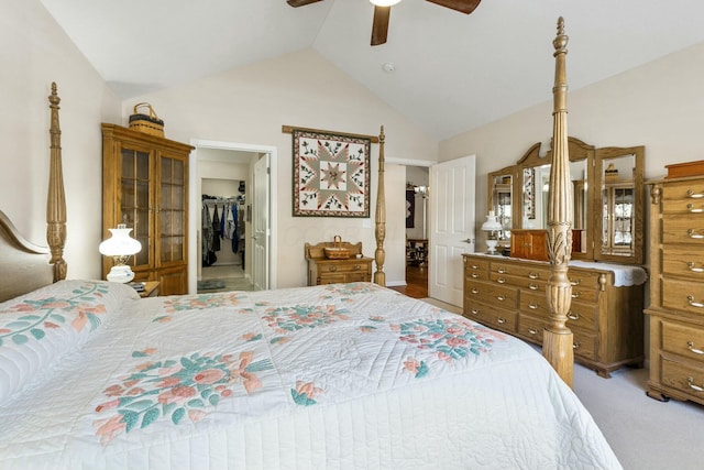 carpeted bedroom featuring a spacious closet, high vaulted ceiling, a closet, and ceiling fan