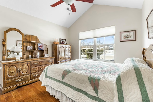 bedroom featuring dark wood-type flooring, ceiling fan, and vaulted ceiling