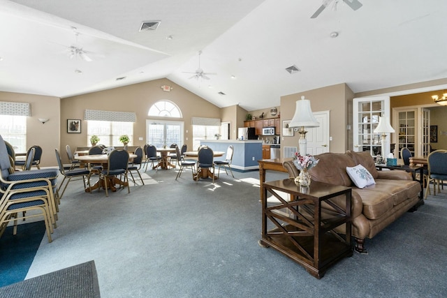 living room featuring ceiling fan, high vaulted ceiling, and carpet floors