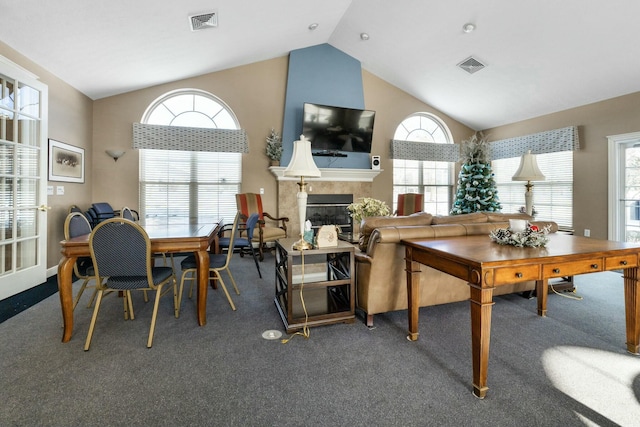 dining room featuring lofted ceiling and carpet floors