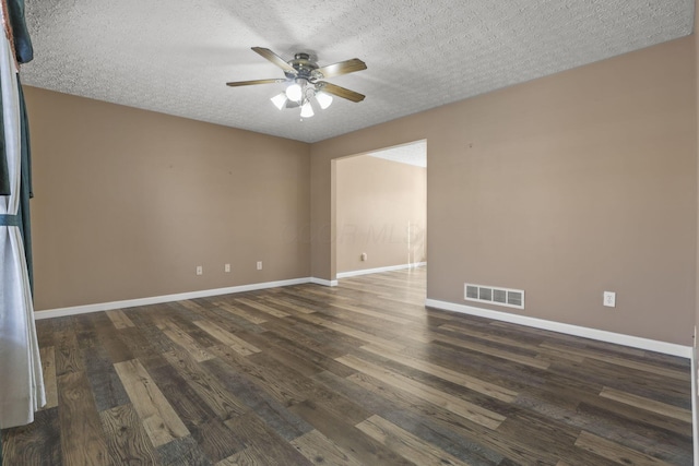 unfurnished room featuring ceiling fan, dark hardwood / wood-style flooring, and a textured ceiling