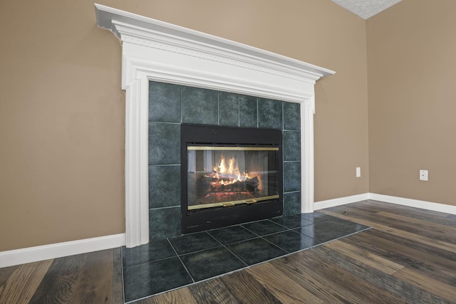 room details with hardwood / wood-style flooring and a fireplace