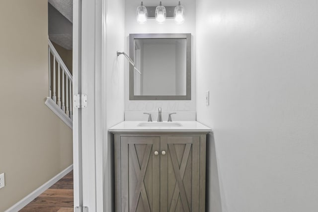 bathroom with vanity and hardwood / wood-style flooring