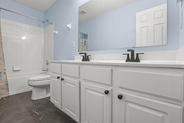 full bathroom with vanity, shower / bath combo with shower curtain, a textured ceiling, and toilet