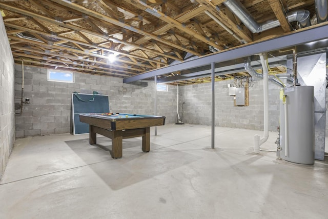 basement featuring billiards, electric panel, and water heater