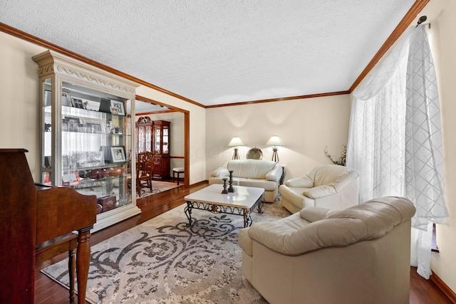 living room featuring a wealth of natural light, crown molding, and hardwood / wood-style flooring