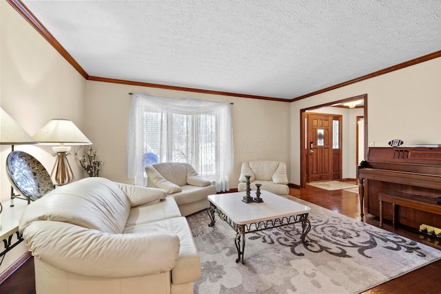 living room with a textured ceiling, ornamental molding, and dark wood-type flooring