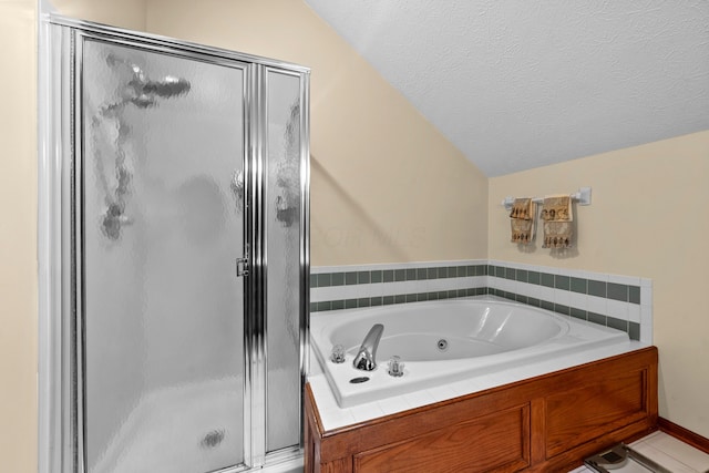 bathroom with shower with separate bathtub, a textured ceiling, tile patterned floors, and lofted ceiling