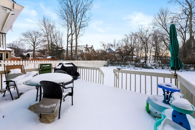 view of snow covered deck