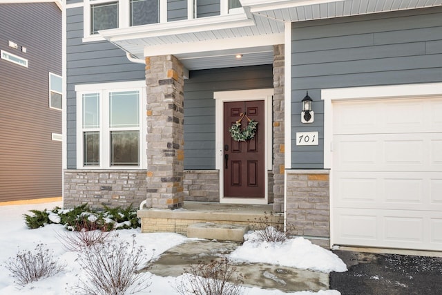 view of snow covered property entrance