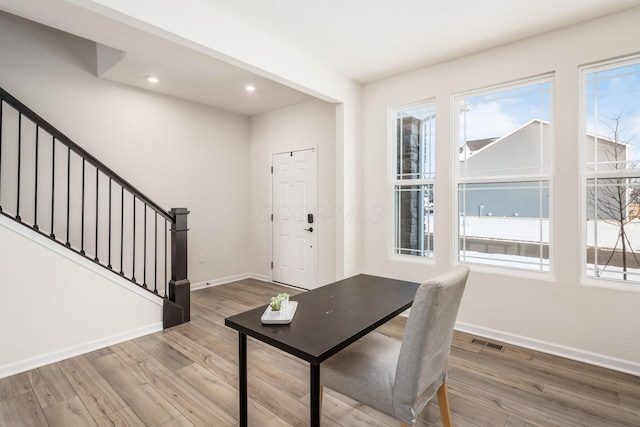 home office with hardwood / wood-style floors