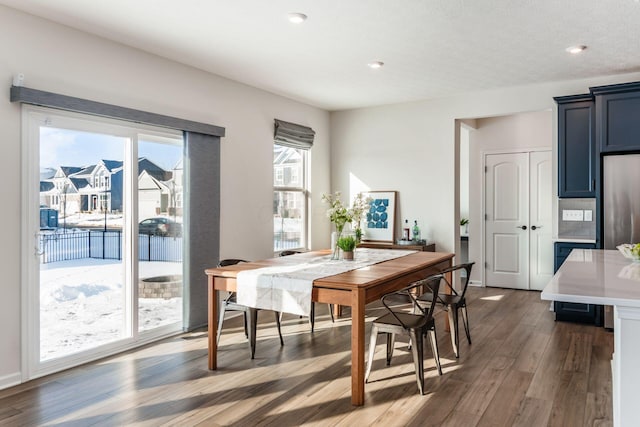 dining room with dark hardwood / wood-style floors