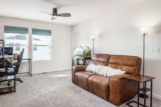 living room with light carpet and ceiling fan