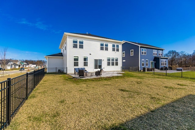 back of property featuring a yard, a patio, and a fenced backyard