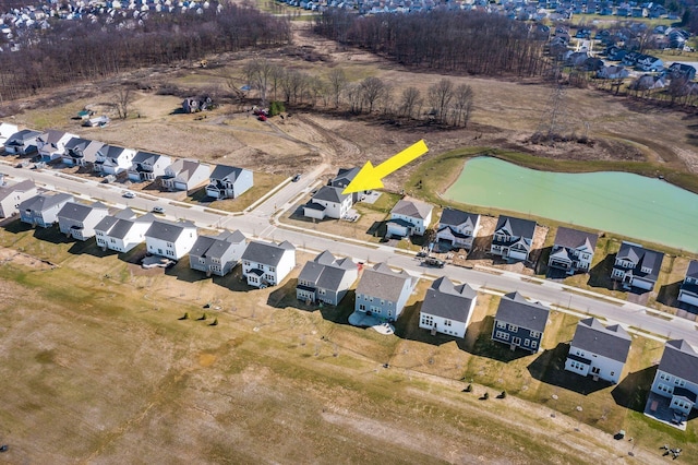 birds eye view of property with a residential view
