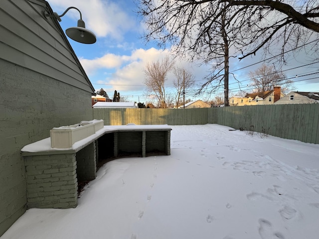 view of yard layered in snow