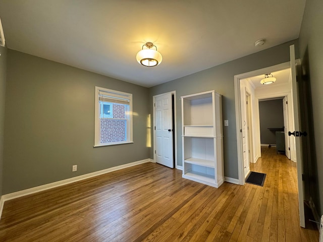 unfurnished bedroom featuring wood-type flooring