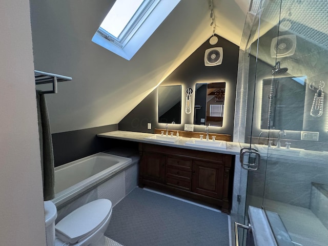 full bathroom with shower with separate bathtub, vanity, toilet, and vaulted ceiling with skylight