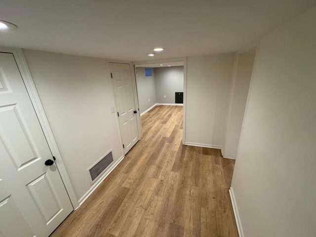 corridor featuring light hardwood / wood-style flooring