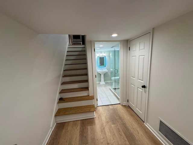 stairway featuring hardwood / wood-style floors