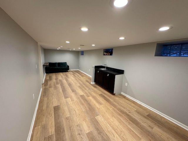 basement with light wood-type flooring