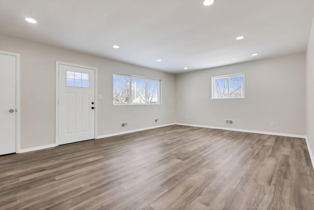 foyer featuring light hardwood / wood-style flooring and a healthy amount of sunlight