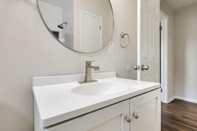 bathroom featuring vanity and hardwood / wood-style flooring