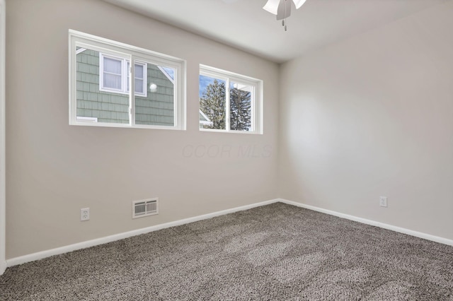 unfurnished room featuring ceiling fan and carpet floors