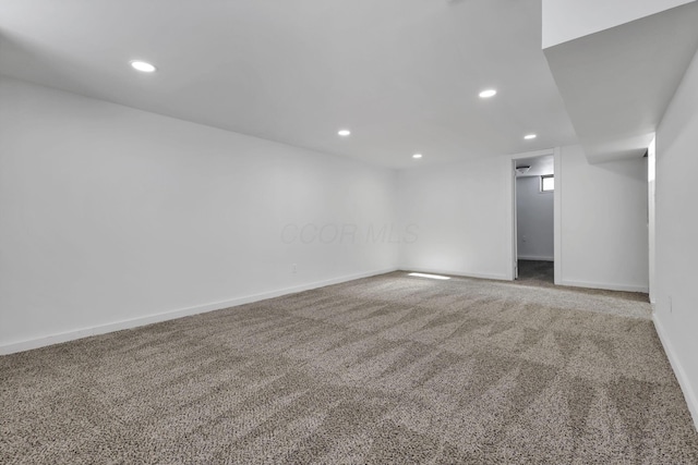 spare room featuring carpet floors