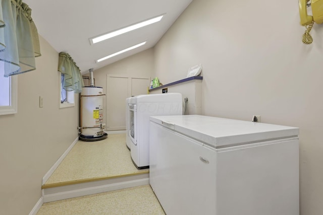 laundry room with washing machine and clothes dryer and gas water heater