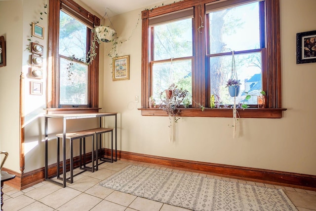 unfurnished room featuring light tile patterned floors