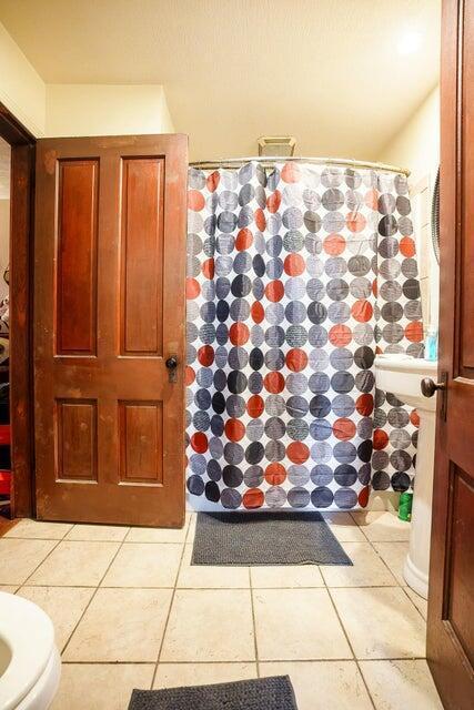 bathroom with tile patterned floors and toilet