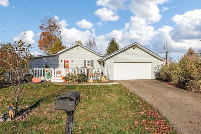 view of front of property with a garage and a front yard