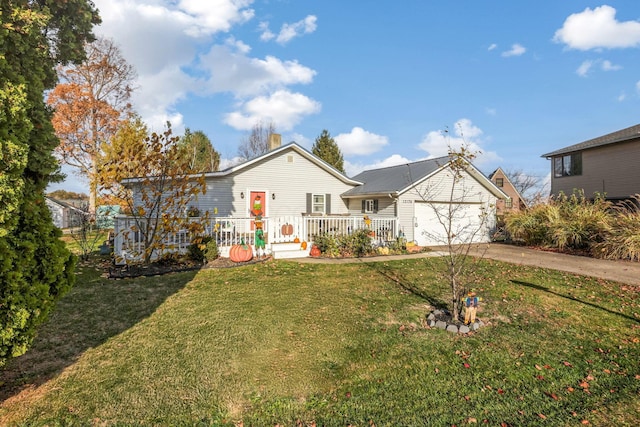 view of front facade featuring a garage and a front lawn