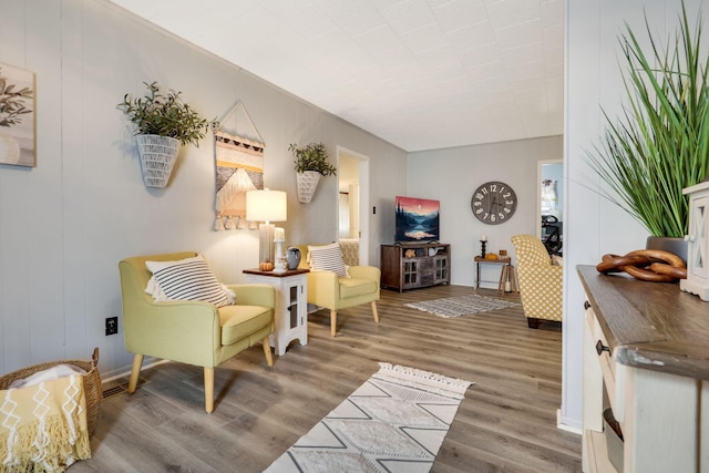 sitting room with hardwood / wood-style floors