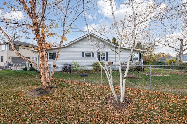 view of side of home featuring a lawn