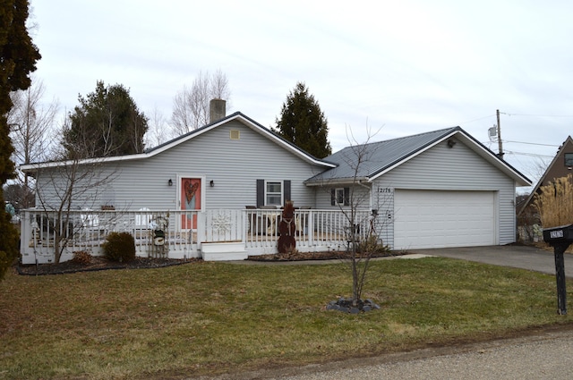 ranch-style home featuring a garage and a front yard