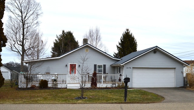 single story home with a garage and a front yard