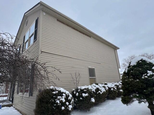 view of snow covered property