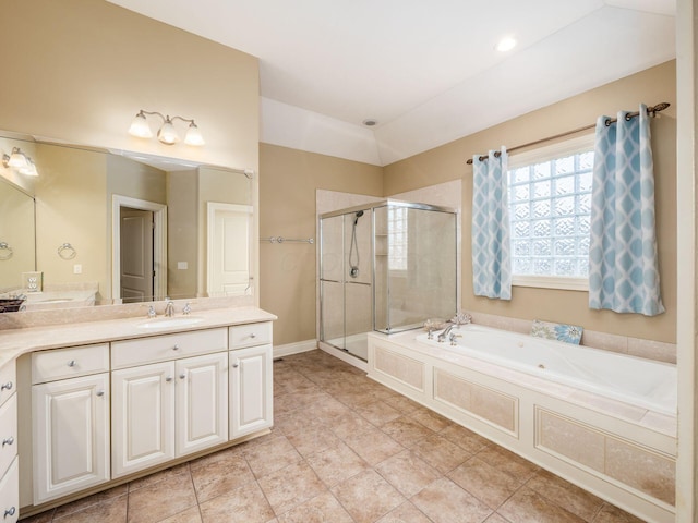 bathroom with lofted ceiling, vanity, separate shower and tub, and tile patterned floors